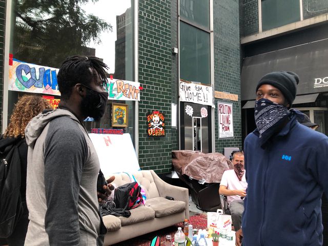 Psycho Wlliams (on Right) wearing a face covering at a recent housing demonstration outside Governor Cuomo's office in Manhattan.